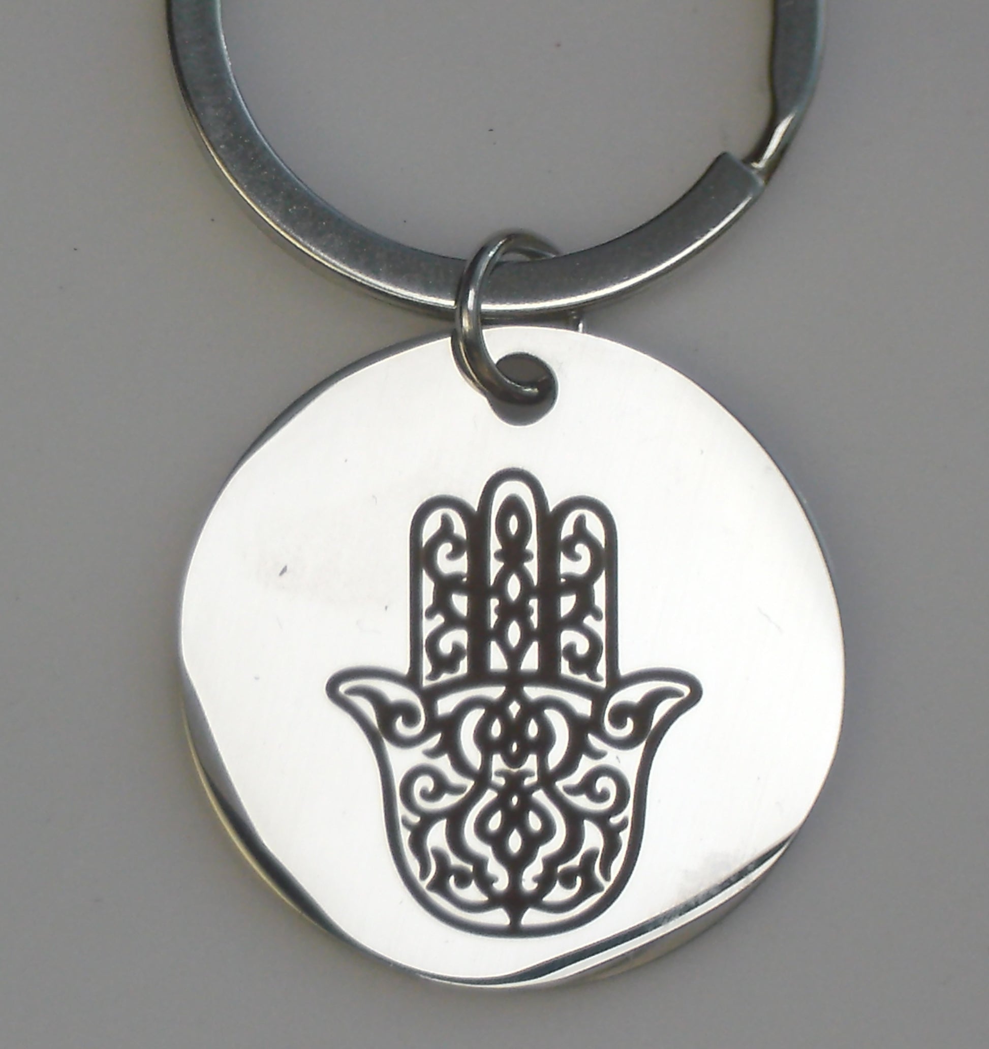 porte clés bijoux de sacs en acier inoxydable argent gravure marquage couleur brun par technologie laser mopa