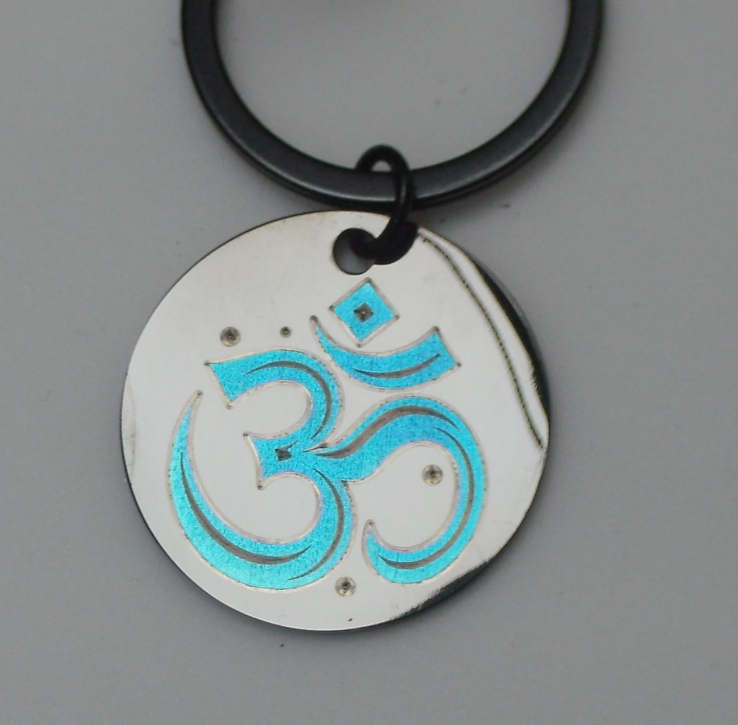 Porte cles / bijoux de sacs en acier inoxydable noir, gravé en couleur par laser MOPA