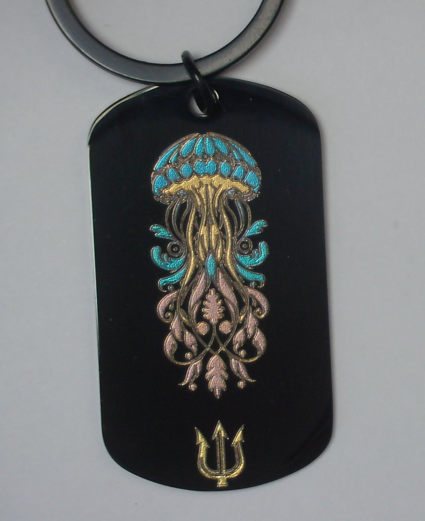 Porte-cles Bijoux de sac noir en acier inoxydable gravé couleur par technologie  laser MOPA 